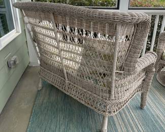 B15 - $75. Plastic Wicker Loveseat. Used on a covered porch. Bench is sturdy, Cushion has damage on the bottom from a squirrel. 