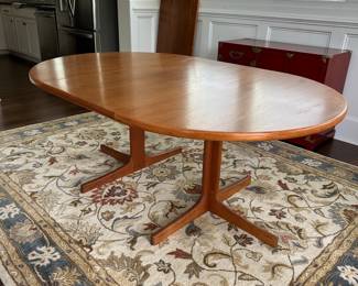 B12 - $600. Teak Dining Table with 2 leaves. Table is 42" round x 29.5" tall. 2 - 20" leaves included. 1 leaf needs refinishing (if you want - just a dark heat spot) 