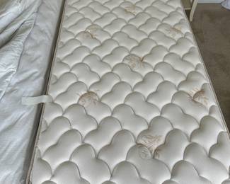 B11 - $250. Wicker Headboard used as a day bed. Twin size mattress with pop up trundle that makes it king sized. 