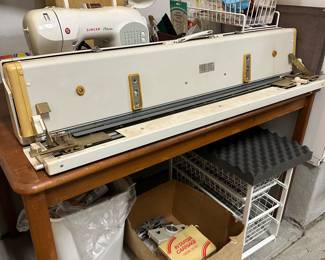 B84 - $200. Singer Knitting Machine. Model 360K. With a box of attachments. 