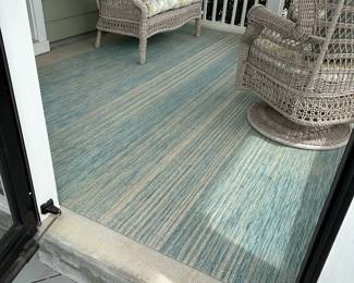 B17 - $40. Safavieh "Aqua Aqua" outdoor area rug. Measures 8' x 11'. 