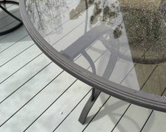 B19 - $50. 42" round Glass Top Patio Table. (Chairs are not useable.) Very minor rust spots but still sturdy and useable!