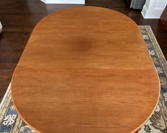 B12 - $600. Teak Dining Table with 2 leaves. Table is 42" round x 29.5" tall. 2 - 20" leaves included. 1 leaf needs refinishing (if you want - just a dark heat spot) 