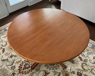 B12 - $600. Teak Dining Table with 2 leaves. Table is 42" round x 29.5" tall. 2 - 20" leaves included. 1 leaf needs refinishing (if you want - just a dark heat spot) 