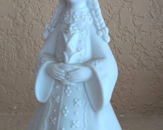 White Porcelain Figurine of a Girl Holding a Flower