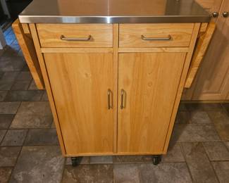 Rolling metal top island