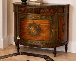 Elegant antique cabinet with floral accents
