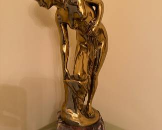 There are several sculptures, like this beautiful gold plated Bronze, and many more great  pieces of art