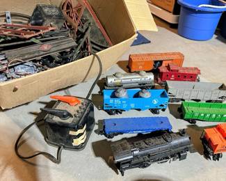 Vintage Lionel train set with engine, cars, track, transformers and other parts