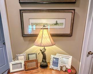 Sampling of many available frames, golfer lamp, framed artwork, and vintage accent table
