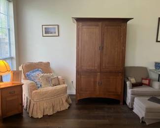 Down filled armchair, armoire and chair with ottoman. Nice antique side table.
