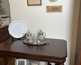 Antique game table with middle drawer. Pewter tea service.