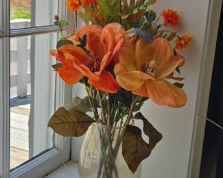 Artificial Floral Arrangement with Orange Magnolia and Mumlike Blossoms in Glass Vase
