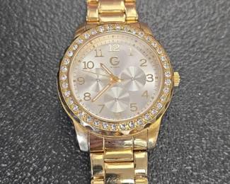 Guess Womens Gold Tone Stainless Steel Watch with Crystal Bezel and Three Subdials