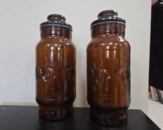 Vintage Amber Glass Apothecary Jars with Embossed Swirls and Dark Lids