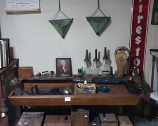 Firestone sign, Owosso snow shovel, Owosso dust pans, Owosso Bottling Works wooden boxes