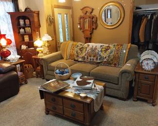 LaZBoy couch, cofee table, end tables, corner cabinet, hall tree, round mirror, deco plates, oil lamps, deco balls