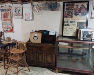 store showcase, Hitchcock dry sink, spool cabinet, Thomas Dewey vinyl record, Curwood movie posters, Owosso Milling, Byerly's bags