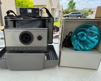 Poloroid Camera and Flash