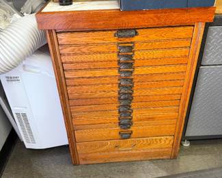 Antique tool and dye cabinet