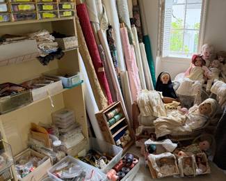 Rare vintage dolls, and bolts of fabric