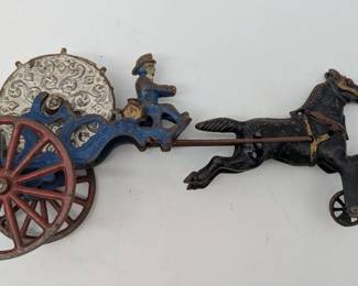 Cast-iron toy horse draw. Fireman with hose wheel