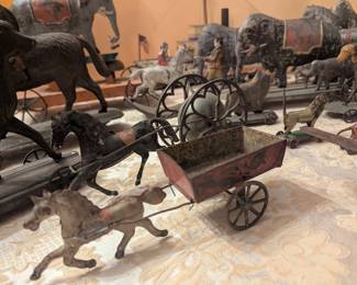 Tin toys galore! Too much to display, some with working bells, others are cast iron