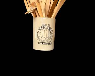Crock with kitchen wooden utensils