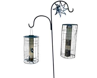 Lots of Shepperd hooks and birdfeeders