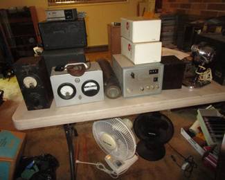 Tables full of vintage electronics, tubes and more