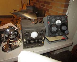 Tables full of vintage electronics, tubes and more