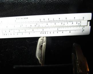 Jewelry case packed (this is a vintage slide rule tie bar)