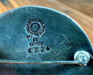 This lot features a Taxco silver zodiac brooch by listed designer, Margot Van Voorhies. Signed on the verso as shown in photos and in excellent condition. Total approx. weight of 19.77 grams.