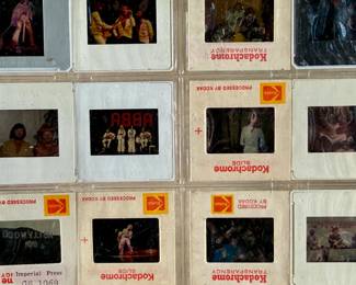 Vintage 35mm slides primarily organized in a transparent holder. Each slide features labels with the name “Richard Creamer” and addresses in Beverly Hills and Los Angeles, CA. Subjects documented include notable music acts such as The Police, David Bowie, ELO, and others. Handwritten annotations accompany several slides. Great condition for archival or display purposes.