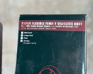 Two boxed Super Flexible Female Seamless Body figures designed for 1/6th scale action figures. Each features 28 points of articulation and a stainless steel skeleton. One box indicates “Med Bust, Pale, Suntan, ” while the other lists “Large Bust, Mid Bust, Tan, Suntan.” Both items are in original packaging with minor signs of handling on the boxes.
