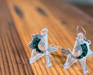 This lot features a pair of stunning vintage Taxco silver "fish" earrings with inlaid malachite.