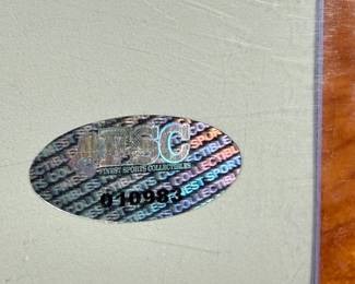 This lot features an iconic photo of Jeff Beck of the Jeff Beck Group. Signed by the photographer possibly, with a cert tag on the lower right as shown in photos. This photo measures, 14” H x 11” W.