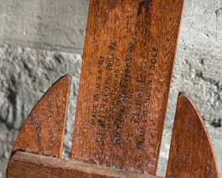 Wooden Flexible Flyer Yankee Clipper sled featuring steel runners painted in red and a wooden deck with printed branding. The sled includes a wooden crossbar for steering and a rope control. Signs of wear consistent with age and use, including scratches and minor rust on metal parts, are visible. A classic item for collectors or enthusiasts of vintage winter gear. Measures, 44” H x 20.5” W.