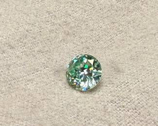 This lot features a large 3.50 carats blue/green moissanite gem from Brazil.