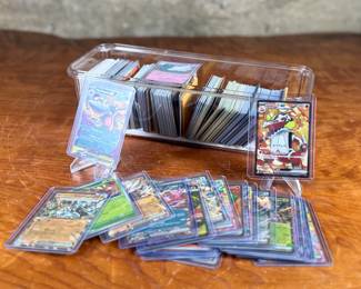 This lot features a large collection of Pokemon cards including both English & Japanese. Many holos and a good amount sleeved for protection.