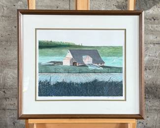 “Across the Meadow”, an original lithograph by listed artist, James Lynch. Signed lower right, professionally framed, and measures in frame, 22” H x 25.5” W. Certificate of authenticity on the verso. James Lynch (b. 1956) grew up in Wiltshire and now lives and works in Somerset. His work is included in the National Trust collections at Kingston Lacy, Wimpole Hall, and Chartwell. Awards include; the Elizabeth Greenshields bursary (83′), the Royal Academy Award for watercolour (86′) and the Spectator Art Award (93′).