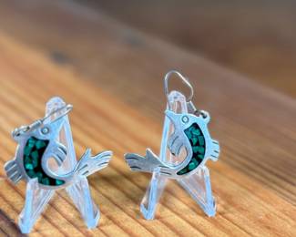 This lot features a pair of stunning vintage Taxco silver "fish" earrings with inlaid malachite.