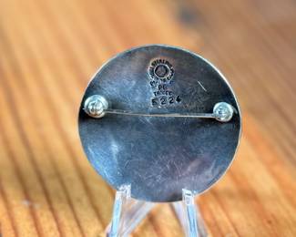 This lot features a Taxco silver zodiac brooch by listed designer, Margot Van Voorhies. Signed on the verso as shown in photos and in excellent condition. Total approx. weight of 19.77 grams.