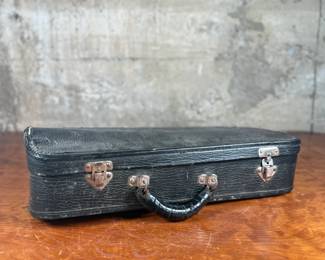 An antique Marceau brass trumpet and case in fair condition.