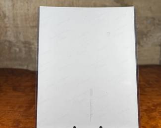 This lot features an iconic photo of Jeff Beck of the Jeff Beck Group. Signed by the photographer possibly, with a cert tag on the lower right as shown in photos. This photo measures, 14” H x 11” W.