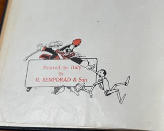 The Adventures of Pinocchio by C. Collodi, printed in Italy by R. Bemporad & Son. This is the third printing of the edition in English text, featuring illustrations in color by Attilio Mussino. Hardcover with a dark blue cover, red spine lettering, and a prominent illustrated design. Published in 1929 by The Macmillan Company. Includes vivid illustrations and period typography.