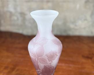 This lot features an Art Nouveau style cameo glass vase, featuring etched floral patterns in a purple or amethyst hue and measures, 10.5” H. Likely circa 1950s.
