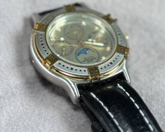 This lot features an Elgin FS-408 Calendar Moon Phase Quartz watch on a genuine leather band. Will need a new battery at minimum.