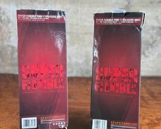 Two boxed Super Flexible Female Seamless Body figures designed for 1/6th scale action figures. Each features 28 points of articulation and a stainless steel skeleton. One box indicates “Med Bust, Pale, Suntan, ” while the other lists “Large Bust, Mid Bust, Tan, Suntan.” Both items are in original packaging with minor signs of handling on the boxes.