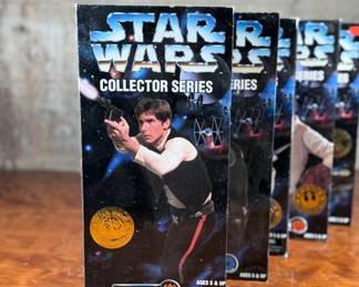Five (5) Star Wars Collector Series action figures in their original packaging, featuring Han Solo, Greedo, Admiral Ackbar, and others. Each figure includes detailed outfits and accessories. Packaging shows minor wear consistent with age and storage.